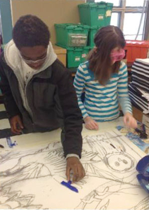 Students working with an illustration for the mural
