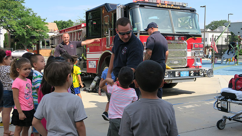 SPELL students talking to Somerville firefighters