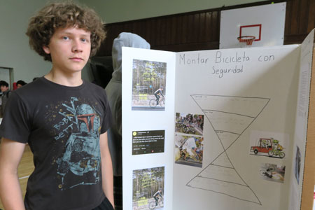 8th Grade ESCS student in front of his Bicycle Safety Presentation in English and Spanish