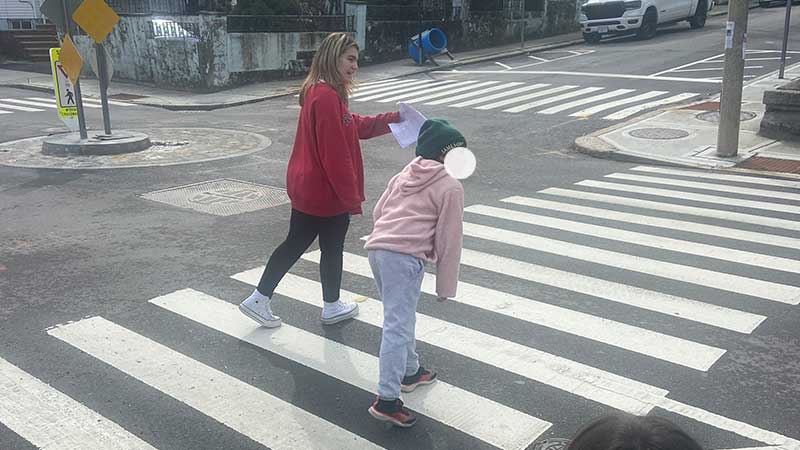 early ed student and young child practice safe pedestrian practices