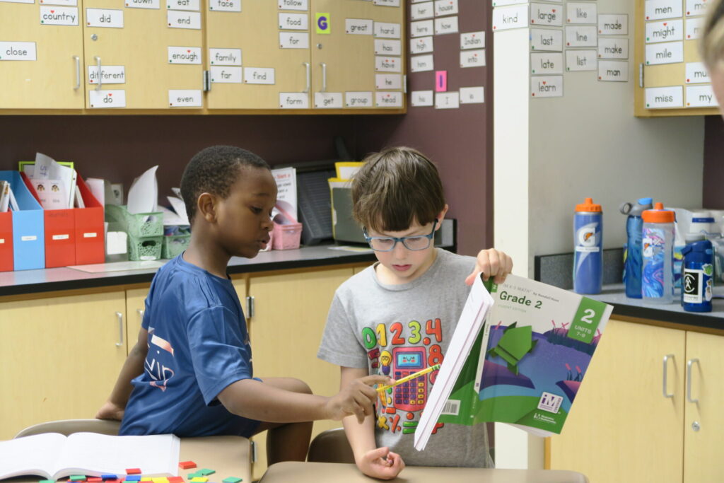 2 students working together in a classroom