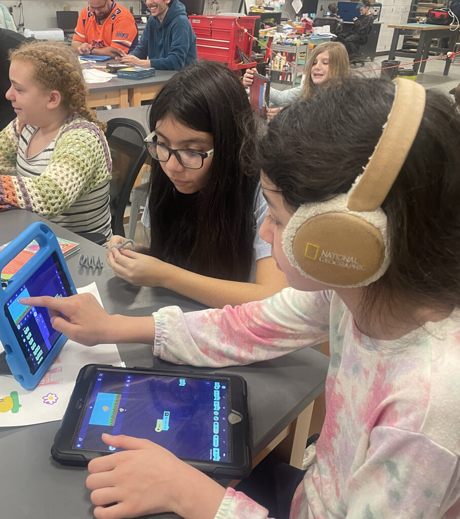Girls working on programming
